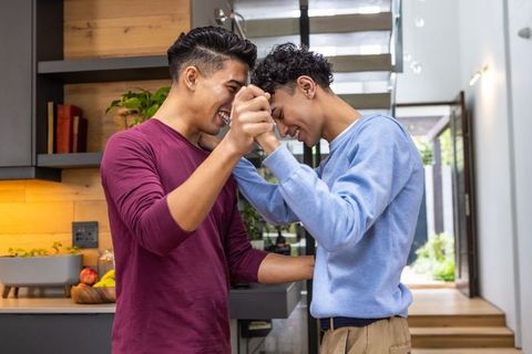 Couple Embracing in Modern Home Kitchen