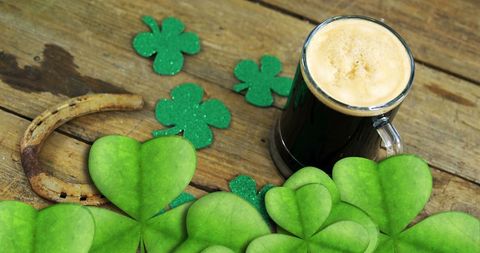 Festive Saint Patrick's Day Beer with Shamrocks on Wood