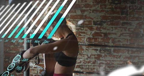 Leaning female boxer resting on ring ropes with digital fitness overlay in brick gym training focus