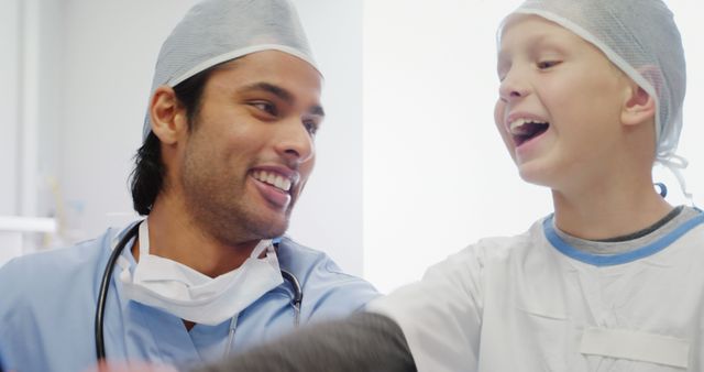 Friendly Doctor and Happy Child Laughing Together - Download Free Stock Images Pikwizard.com