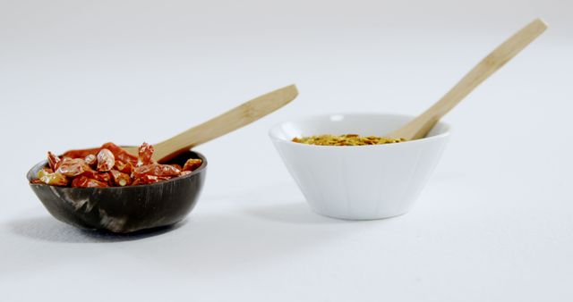 Dried Red Peppers and Cracked Red Pepper in Bowls with Wooden Spoons - Download Free Stock Images Pikwizard.com