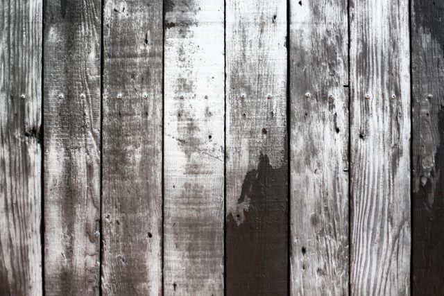 This rustic wooden background features old, brown-weathered planks with visible grain and age marks. Ideal for use in designs relating to country living, nature, vintage themes, or DIY projects. Perfect for website backgrounds, promotional materials, and home decor projects alike.