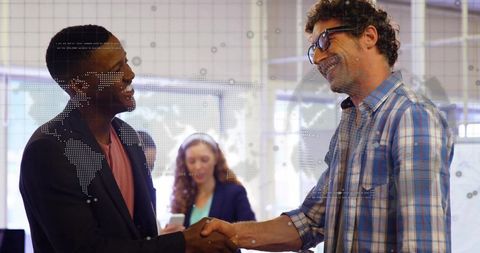 Colleagues Shaking Hands with Digital World Map Overlay in Modern Office