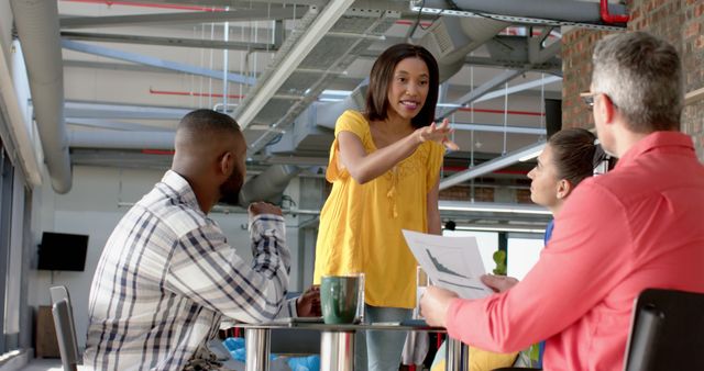 African American Businesswoman Leading Team Discussion in Modern Office - Download Free Stock Images Pikwizard.com