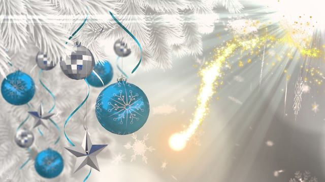 Image depicts shimmering blue and silver baubles and a metallic star hanging from a Christmas tree branch, with a bright golden shooting star and gentle falling snowflakes in background. Radiant golden light creates festive mood, making it ideal for holiday greeting cards, Christmas event invitations, or seasonal marketing materials.