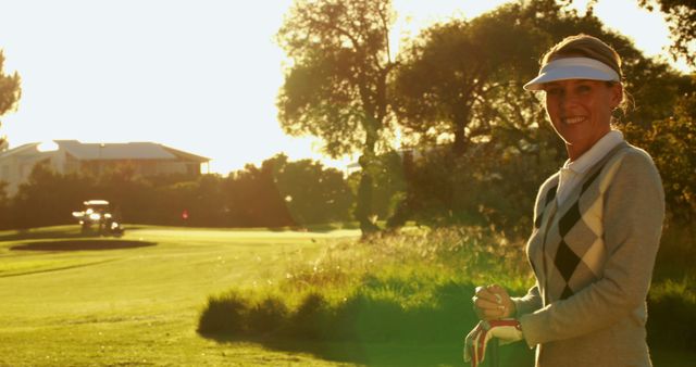 Woman Playing Golf at Sunset Wearing Sun Visor - Download Free Stock Images Pikwizard.com