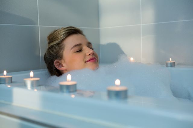 Woman Relaxing in Bubble Bath with Candles - Download Free Stock Photos Pikwizard.com