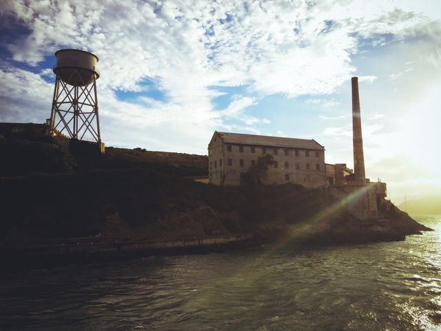 Historic Alcatraz Island buildings at sunrise - Download Free Stock Photos Pikwizard.com