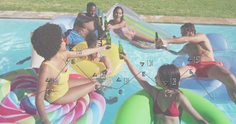 Friends enjoying summer pool party with beverages
