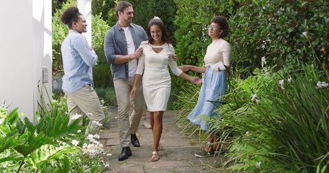 Friends enjoying outdoor gathering in lush garden