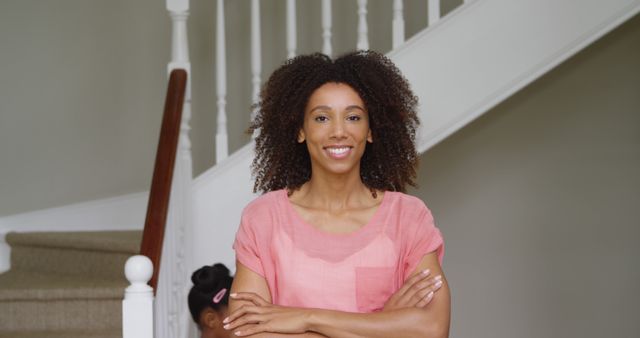 Confident African American Woman Standing with Arms Crossed at Home - Download Free Stock Images Pikwizard.com