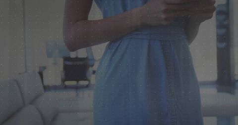 Modern woman using smartphone in stylish lounge