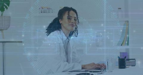 Innovative Scientist Typing on Laptop in Modern Office Setting