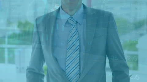 Businessman with Financial Data Overlay