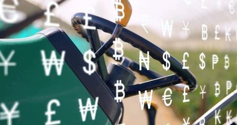 Tractor controls displaying floating currency symbols showing farm finance and commodities
