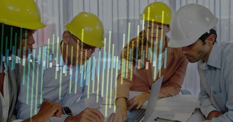 Construction Team Reviewing Blueprints with Data Visualization for Project Planning