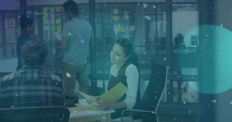 Collaborative Team Meeting with Woman Analyzing Documents