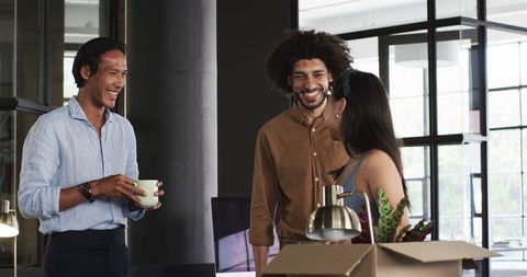 Diverse Colleagues Networking in Modern Office Environment
