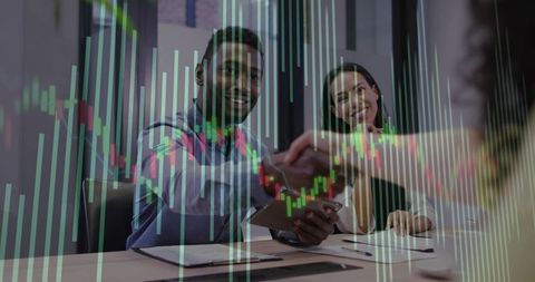 Business Deal Handshake with Stock Market Data Overlay