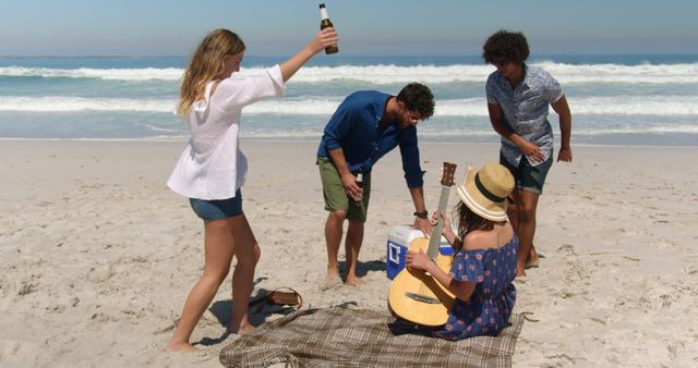 Group of Friends Enjoying Beach Day with Guitar and Drink - Download Free Stock Images Pikwizard.com