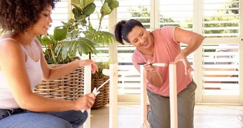 Mother and daughter bond over diy furniture painting at home