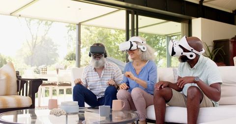 Senior Friends Experiencing Virtual Reality Together at Home