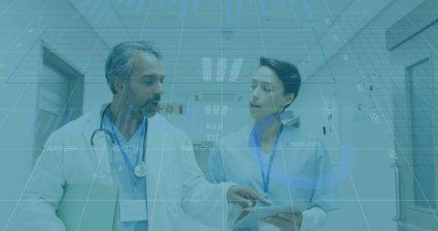 Doctors Analyzing Data in Hospital Corridor - Download Free Stock Images Pikwizard.com