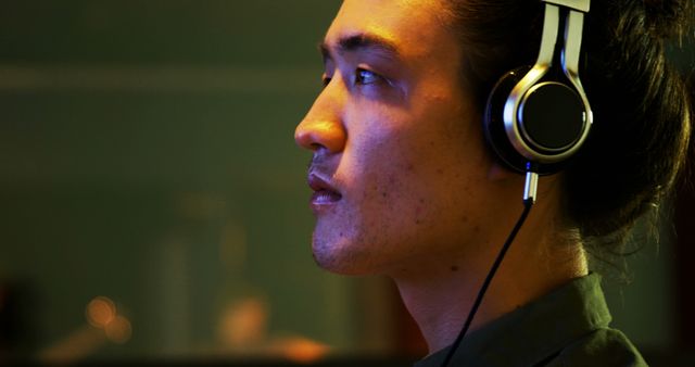 Focused Man with Headphones Listening to Music - Download Free Stock Images Pikwizard.com