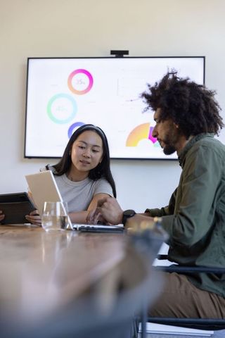 Diverse Team Collaborating on Business Strategy in Conference Room