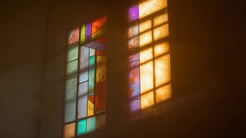 Sunlight Through Stained-Glass Windows Creating Luminous Patterns