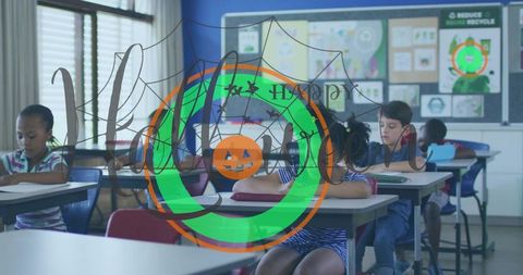 Elementary students writing at desks in classroom with halloween pumpkin overlay
