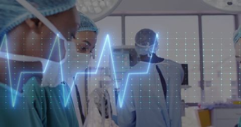Surgeons Performing Procedure with Cardiograph Overlay - Download Free Stock Images Pikwizard.com