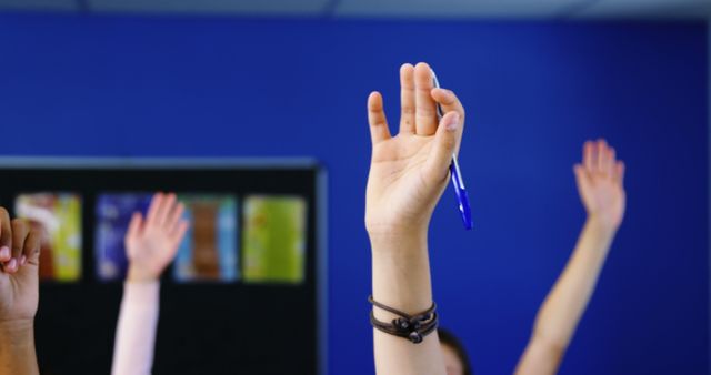 Students Raising Hands in Classroom Engaged in Learning Activity - Download Free Stock Images Pikwizard.com