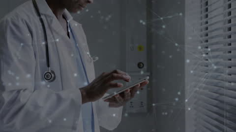 African American Doctor Using Tablet with Digital Network Graphics