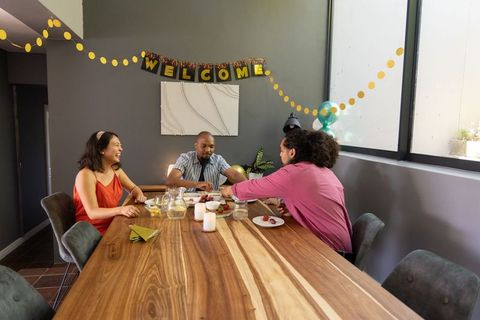 Friends Celebrating Special Occasions in Modern Dining Room