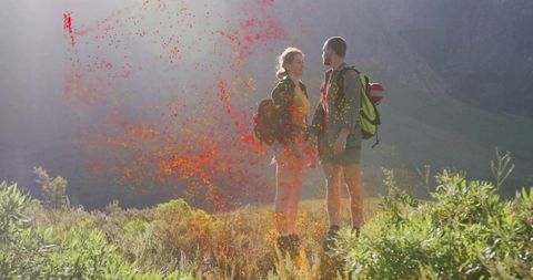 Couple Embracing Adventure on Mountain Hike with Vibrant Dust Effect