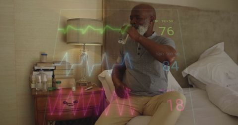 Senior African American Man Amidst Digital Health Monitoring In Bed