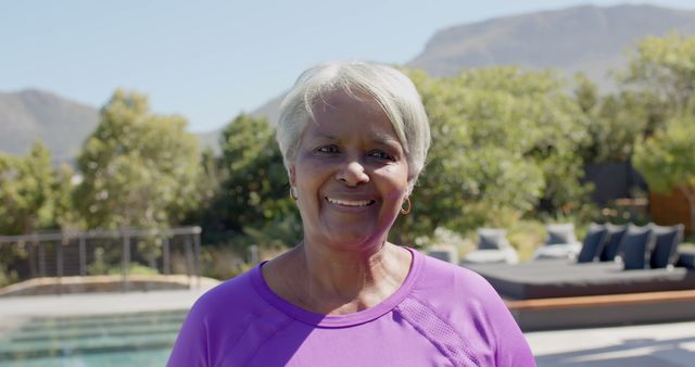 Happy Elderly Woman Smiling Outdoors Near Pool - Download Free Stock Images Pikwizard.com