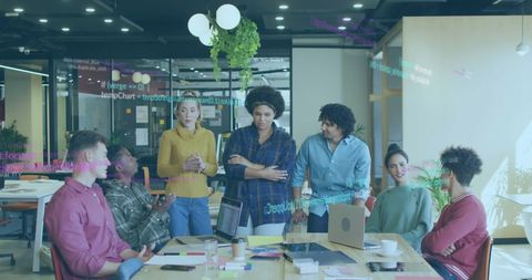 Diverse Team Processing Digital Financial Data in Modern Office