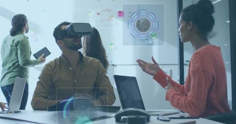 Team Collaborating with VR and Holographic Interface During Futuristic Brainstorming Session