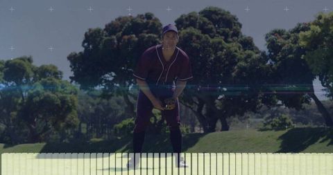 Focused Baseball Player Ready for Action in Sunny Park