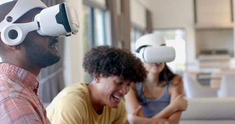 Diverse Friends Enjoying Virtual Reality Experience in Bright Living Room