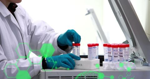 Laboratory scientist analyzing test samples with technology overlay