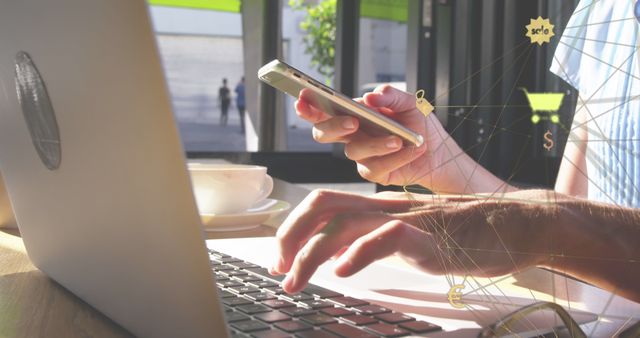 Image showing person working on laptop while holding smartphone, suggesting multitasking in digital marketing or e-commerce activities. Suitable for illustrating online businesses, digital connectivity, remote work, and modern communication themes. Ideal for website banners, blog posts, and presentations related to technology, online retail, and mobile shopping.