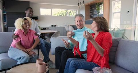 Diverse Friends Celebrating Pregnancy Together at Home