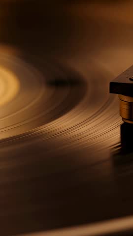 Spinning Vinyl Close-Up Guiding Tonearm Stylus into Grooves for Retro Audio Vertical Video
