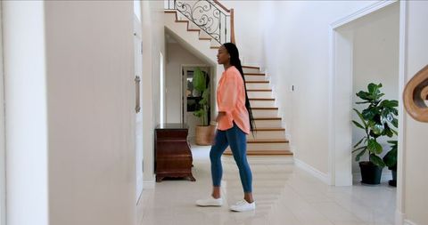 mom greeting daughter returning home from school in bright hallway - Download Free Stock Images Pikwizard.com
