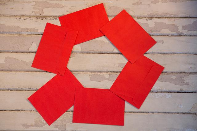 Red envelopes decorated on wooden plank during christmas time