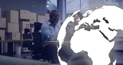 Businessman working with digital globe interface in modern office