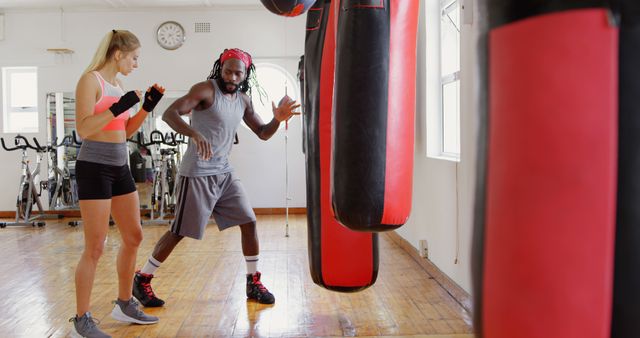 Personal Trainer Coaching Female Boxer in Gym - Download Free Stock Images Pikwizard.com